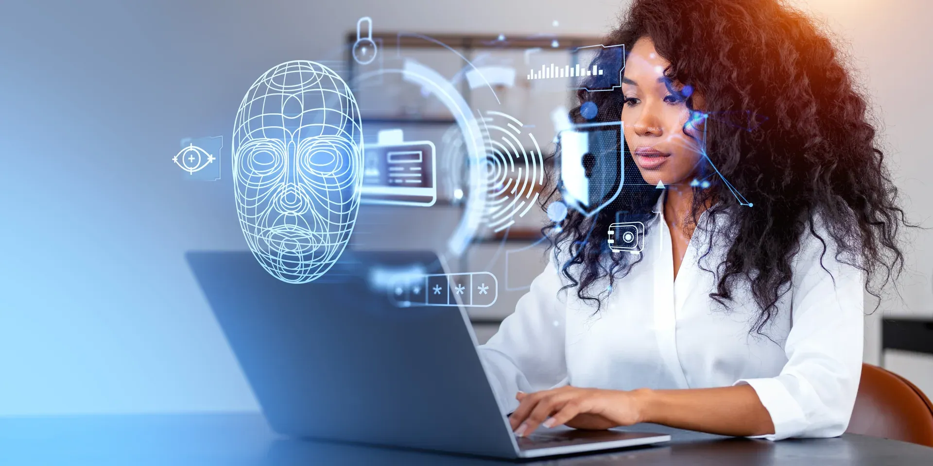 A creator working at her laptop, watched by a face-recognition overlay — the everyday reality AURA exists to address